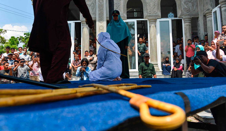 Hundreds Watch As Couples Caught Cuddling In Public Are Caned In Indonesia The Week