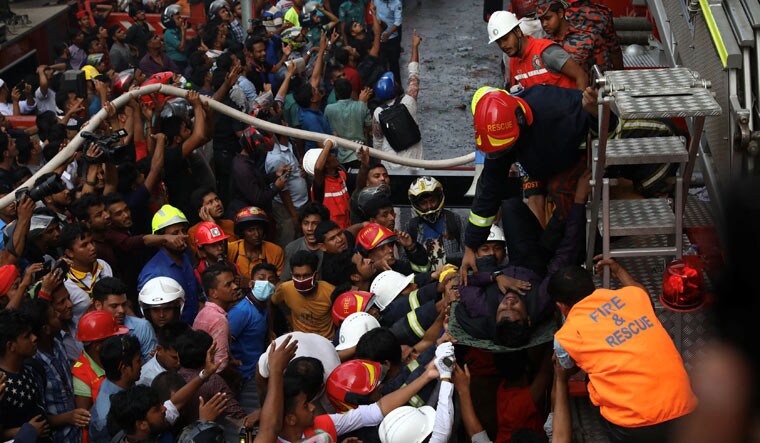 Fire and Rescue personnel at work at the scene of the blaze | Reuters