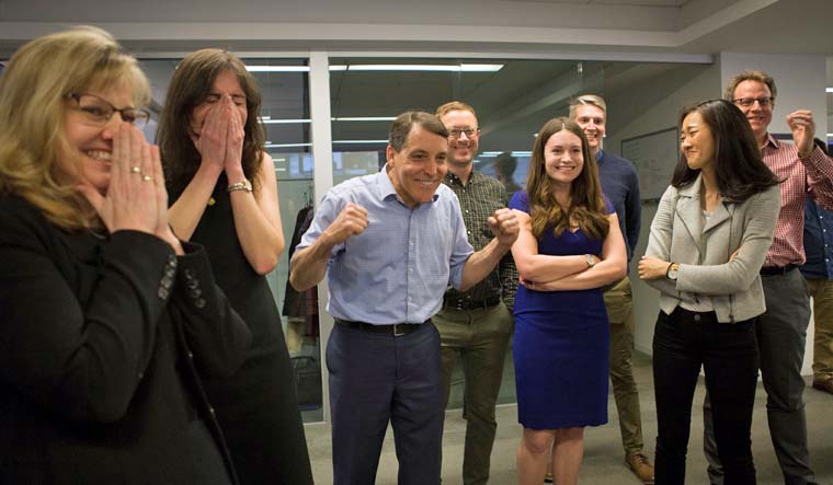 The Wall Street Journal staff celebrates the paper's Pulitzer Prize win for National Reporting | Reuters