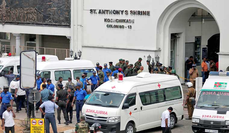 Sri Lankan military officials stand guard in front of the St. Anthony's Shrine, Kochchikade church after an explosion in Colombo | Reuters