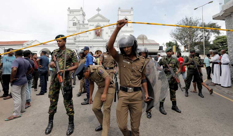 Sri Lankan military officials stand guard in front of the St Anthony's Shrine, Kochchikade church | Reuters