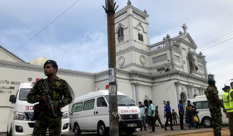 Sri Lankan military officials stand guard in front of the St Anthony's Shrine, Kochchikade after an explosion in Colombo | Reuters