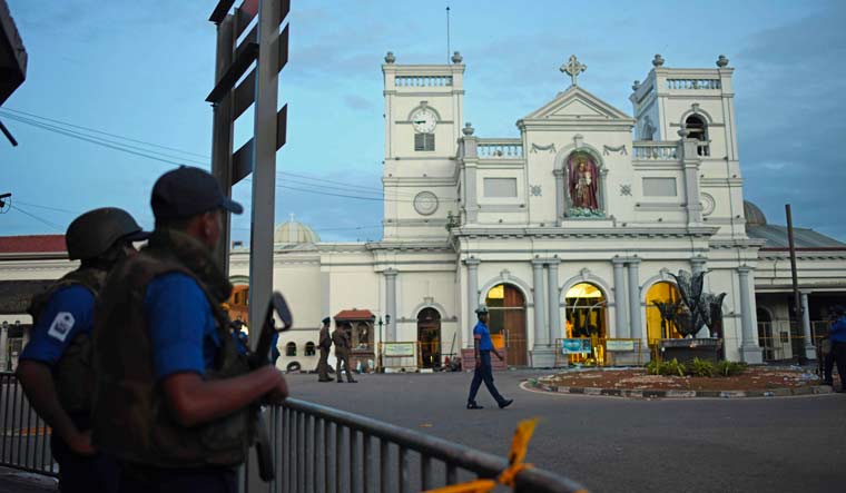 Security personnel stand guard outside St. Anthony's Shrine in Colombo, two days after the church was hit in a series of bomb blasts | AFP