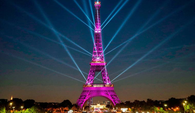Eiffel Tower during a light show celebrating the 130th anniversary of its construction, in Paris | AFP