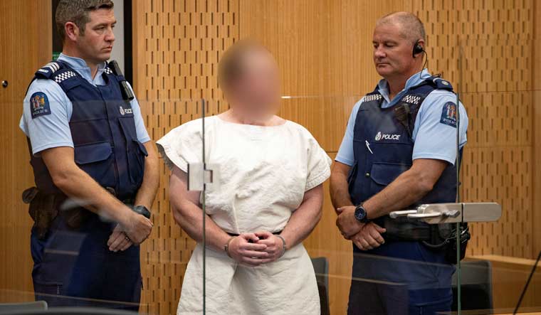 Brenton Tarrant, charged for murder in relation to the mosque attacks, is seen in the dock during his appearance in the Christchurch District Court, New Zealand | Reuters