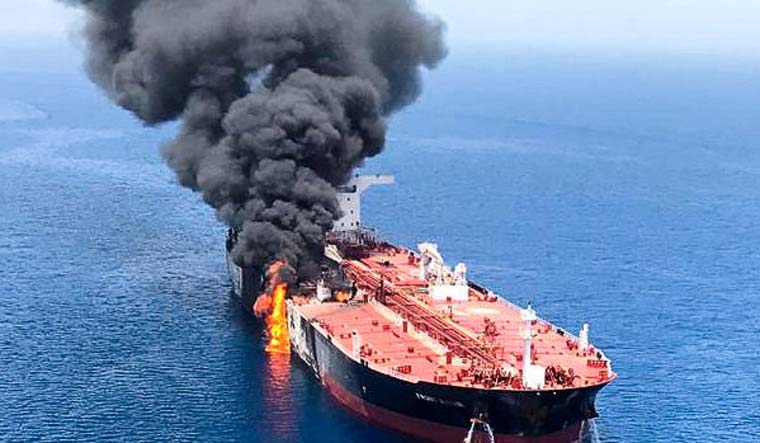 An oil tanker is seen after it was attacked in the Gulf of Oman | Reuters