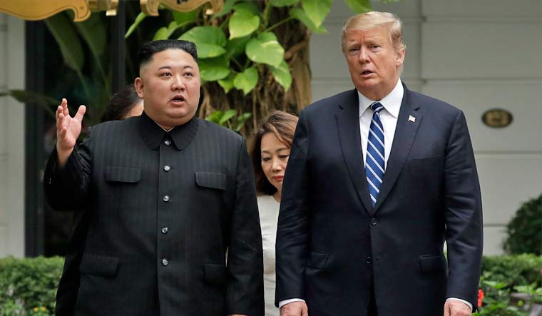 US President Donald Trump with North Korean leader Kim Jong Un at the Hanoi summit in Feb 2019 | AP