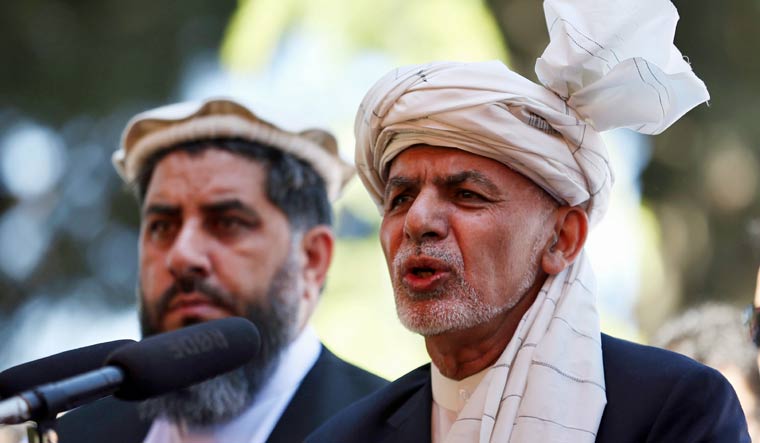 Afghanistan's President Ashraf Ghani, right, speaks during the Eid al-Fitr at the presidential palace in Kabul, Afghanistan | AP