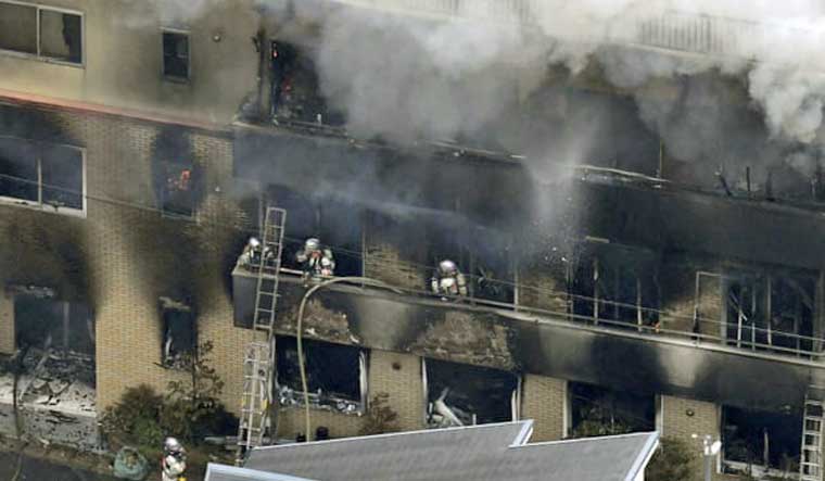 Fire fighters at the Kyoto Animation building | Reuters