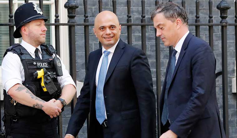 Britain's new Chancellor of the Exchequer Sajid Javid, and Northern Ireland Secretary Julian Smith, right, arrive for a Cabinet meeting at 10 Downing Street in London | AP