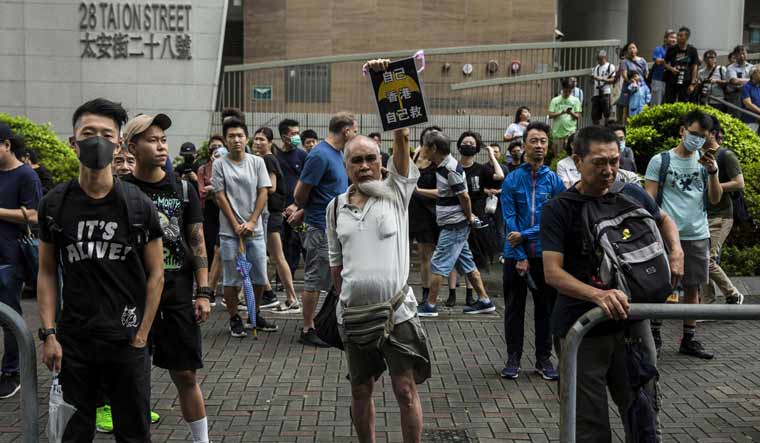 Demonstrators gather outside the eastern district court in Hong Kong on Wednesday | AFP