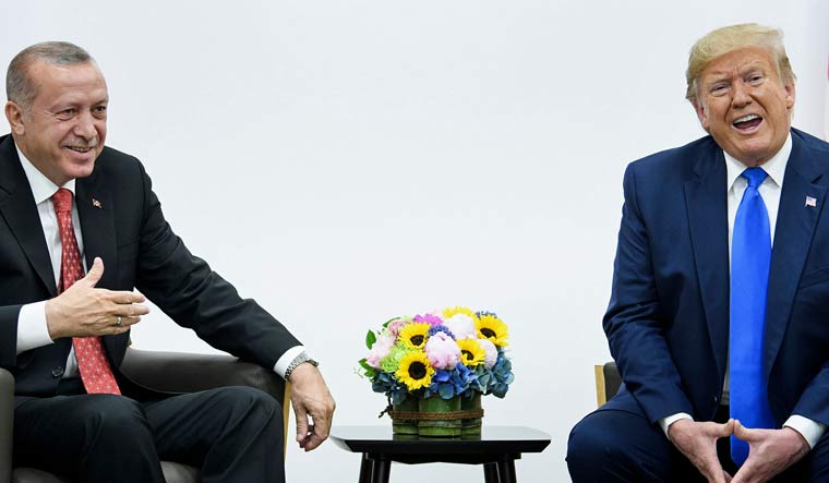 Turkey's President Recep Tayyip Erdogan (L) and US President Donald Trump | AFP