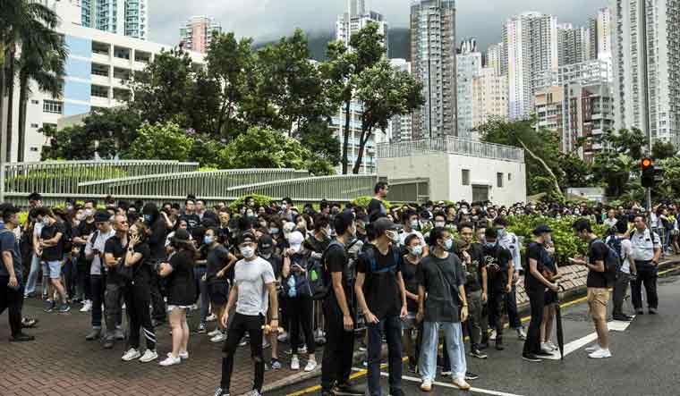 Demonstrators gather outside the Eastern district court in Hong Kong | AFP