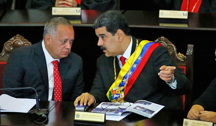 [File] Venezuelan President Nicolas Maduro, right, speaks with Constitutional Assembly President Diosdado Cabello | AP