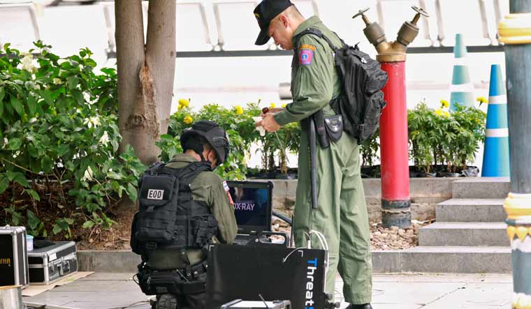 Police Explosive Ordnance Disposal (EOD) officers work following a small explosion at a site in Bangkok | Reuters
