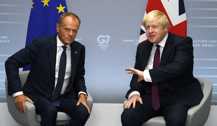 Britain's Prime Minister Boris Johnson meets European Union Council President Donald Tusk at a bilateral meeting during the G7 summit in Biarritz, France August 25, 2019