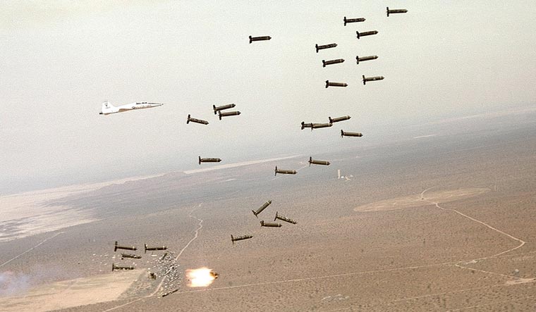 Representational image of a test of cluster bombs by the US Air Force; notice the munitions at the bottom breaking up into smaller submunitions | USAF