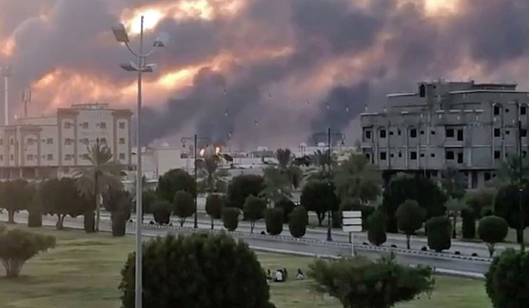 Smoke is seen following a fire at an Aramco factory in Abqaiq, Saudi Arabia | Reuters