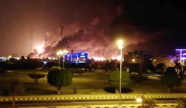 Smoke is seen following a fire at an Aramco factory in Abqaiq, Saudi Arabia on Saturday | Reuters