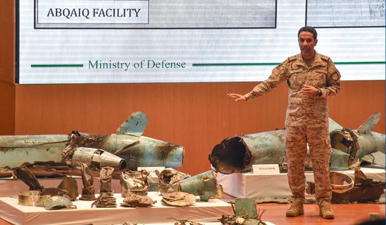Saudi Colonel Turki bin Saleh al-Malki displays pieces of what he said were Iranian cruise missiles and drones recovered from the attack site that targeted Saudi Aramco's facilities, during a press conference in Riyadh on September 18, 2019 | AFP