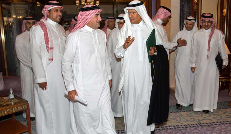 Saudi Arabia's Energy Minister Prince Abdulaziz bin Salman (C) arrives for a press conference in the Red Sea coastal city of Jeddah | AFP