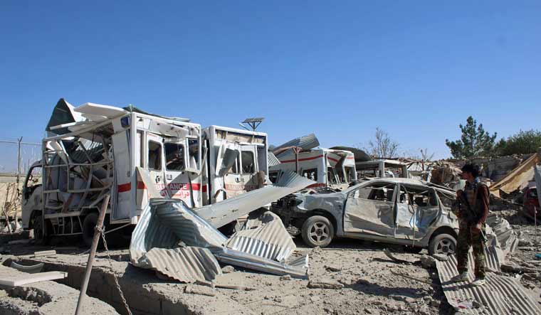 Afghan security forces investigate the site where a Taliban car bomb detonated near an intelligence services building in Qalat in Zabul | AFP