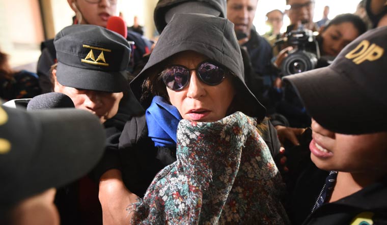 Former first lady and former presidential candidate Sandra Torres is escorted by police to the Supreme Court in Guatemala City, Monday, Sept. 2, 2019 | AP