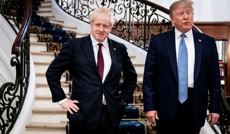 (File) US President Donald Trump and Britain's Prime Minister Boris Johnson arrive for a bilateral meeting during the G7 summit in Biarritz, France in August 2019 | Reuters