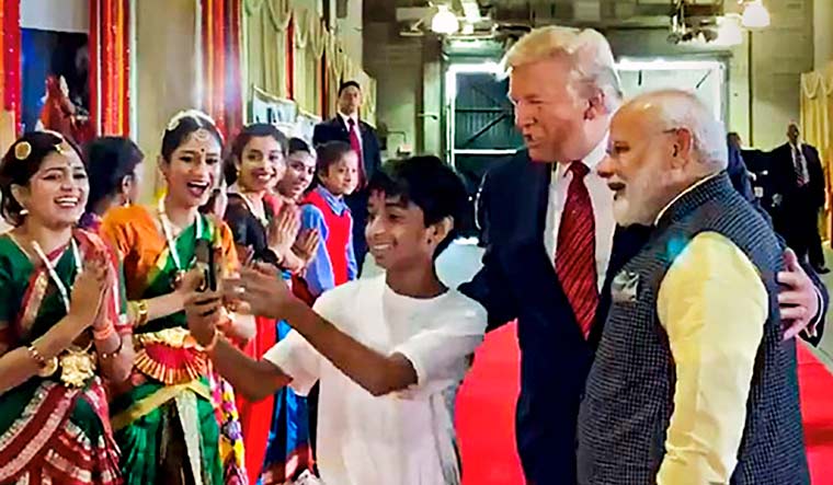 A young boy clicks a selfie with Prime Minister Narendra Modi and US President Donald Trump | PTI