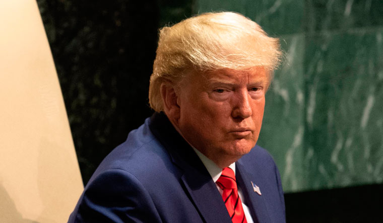 US President Donald Trump looks at the crowd after speaking during the 74th Session of the United Nations General Assembly at UN Headquarters in New York | AFP