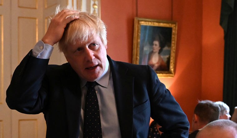 File: Britain's Prime Minister Boris Johnson reacts as he meets with NHS workers inside 10 Downing Street in London, Britain September 3, 2019 | Reuters
