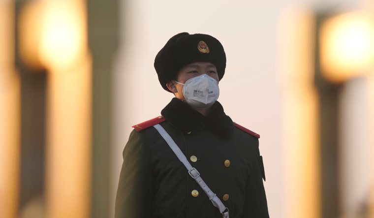 Chinese-guard-tianenmen-coronavirus-Reuters