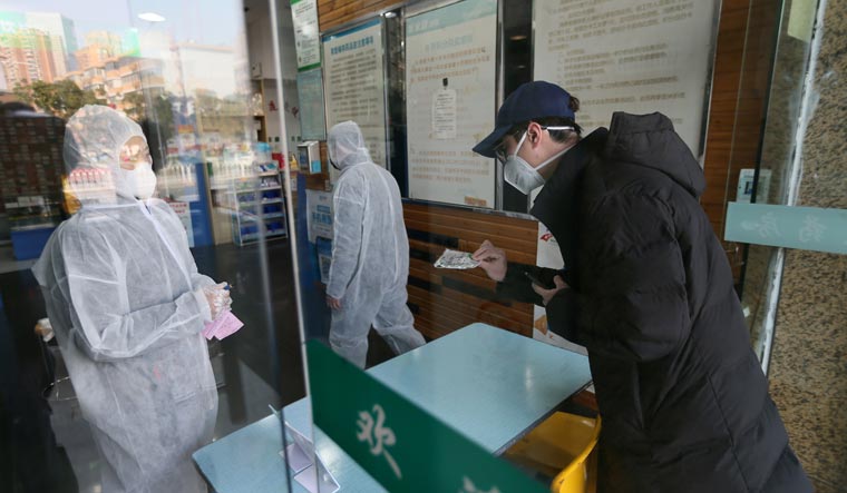 Death toll in China's coronavirus soars to 213, confirmed cases reach 9692
