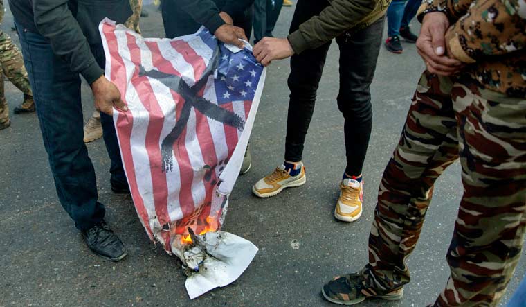 US-flag-iraq-protest-AP