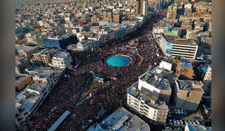 In this aerial photo released by an official website of the office of the Iranian supreme leader, mourners attend a funeral ceremony for Iranian Gen. Qassem Soleimani and his comrades, who were killed in Iraq in a U.S. drone strike on Friday, in Tehran, Iran, Monday, Jan. 6, 2020 | AP/PTI