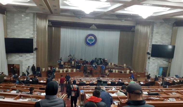 Protesters are seen inside the parliament building, known as the White House, in Bishkek, Kyrgystan October 5, 2020 in this still image taken from social media video obtained on October 6, 2020 | TWITTER/GRAFECRISTO via REUTERS 
