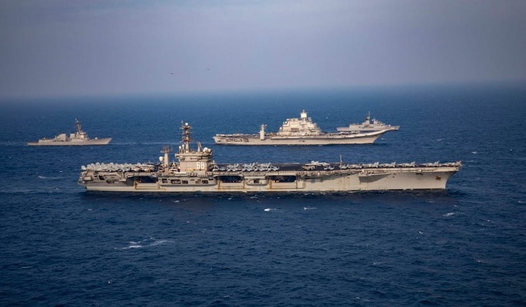 The USS Nimitz (foreground) and INS Vikramaditya sailing together in the Malabar exercise | Via Twitter