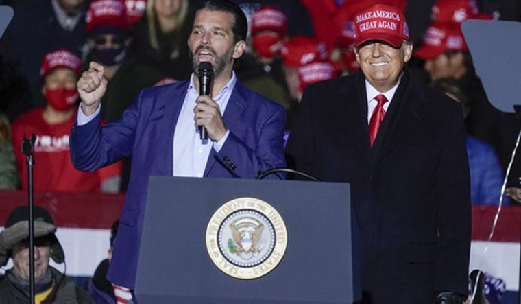 (File) Donald Trump Jr (left) with his father at an election rally | AP