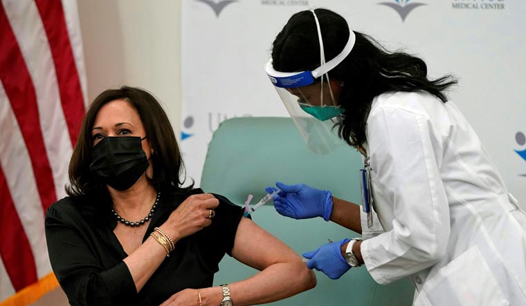 Registered nurse Patricia Cummings administers the COVID-19 vaccine to Vice President-elect Kamala Harris | AFP