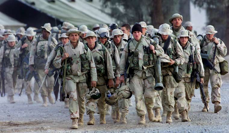 [File] US Marines with full battle gear prepare to leave the US military compound at Kandahar airport for a mission to an undisclosed location | AP