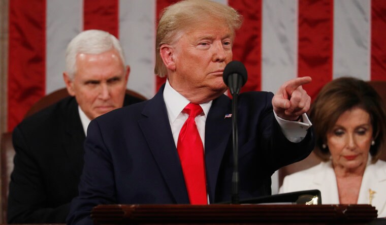 US President Donald Trump gestures during his State of the Union address | Reuters