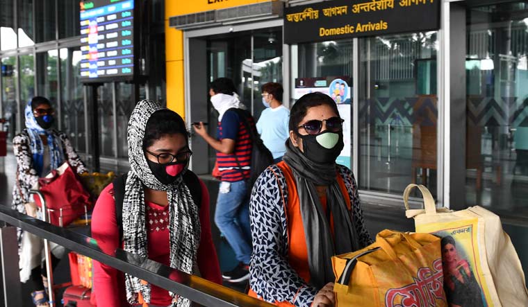 Passengers wearing masks in the wake of coronavirus scare coming out of Kolkata airport | Salil Bera