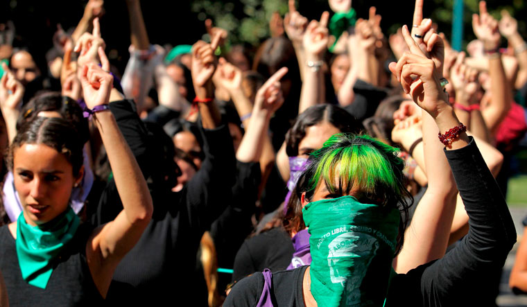 Students perform 'El violador eres t' (The rapist, is you) -a song by Chilean Lastesis which became viral worldwide following their country's social protests- during a demonstration against gender violence and patriarchy in Guadalajara, Mexico | AFP