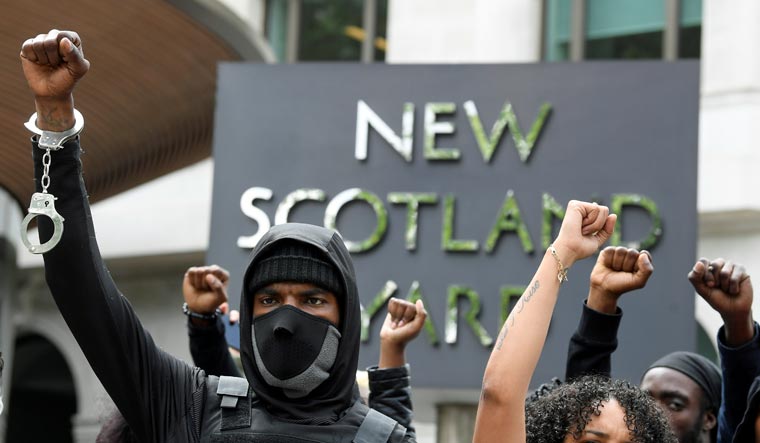 Demonstrators during a Black Lives Matter protest outside New Scotland Yard police headquarters, following the death of George Floyd who died in police custody in Minneapolis, London, Britain | Reuters