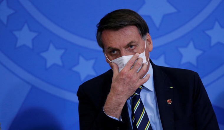 FILE PHOTO: Brazil's President Jair Bolsonaro wearing a protective face mask | REUTERS/Adriano Machado/File Photo