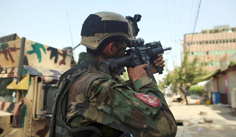 An Afghan security person takes position in front of a prison after an attack in the city of Jalalabad, east of Kabul, Afghanistan, Monday, August 3, 2020 | AP