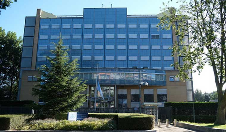 The flag flies at half staff outside the Special Tribunal for Lebanon, in Leidschendam, the Netherlands, Wednesday August 5, 2020 | AP