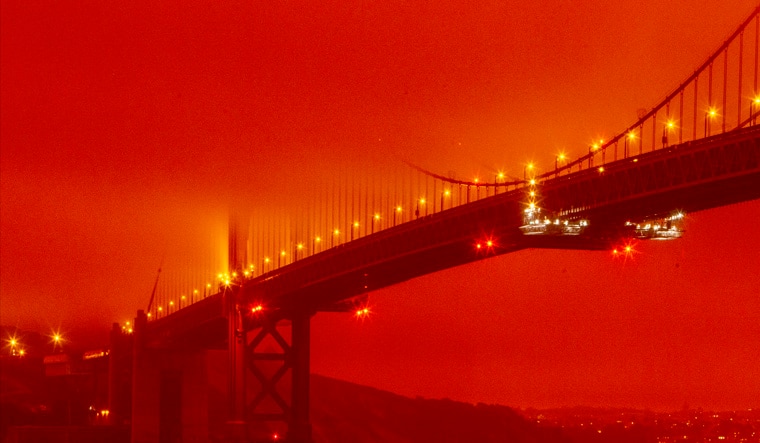 A smoky, orange hue caused by the ongoing wildfires in California | AP