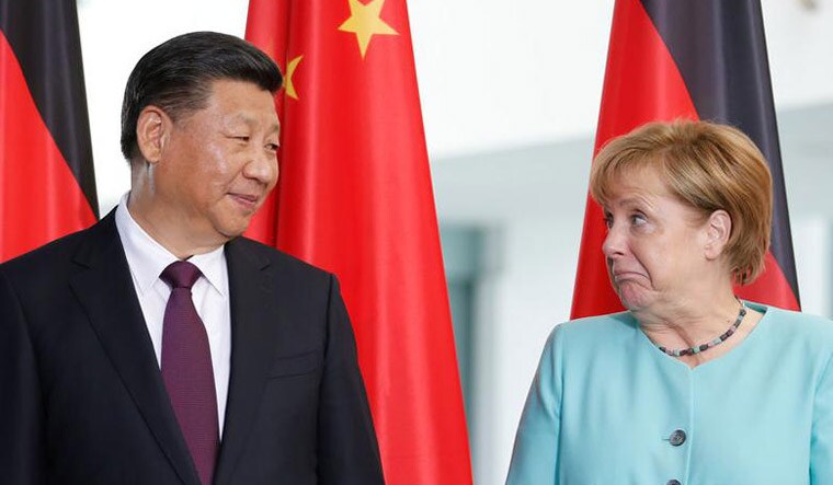 Chinese premier Xi Jinping and German chancellor Angela Merkel | Reuters