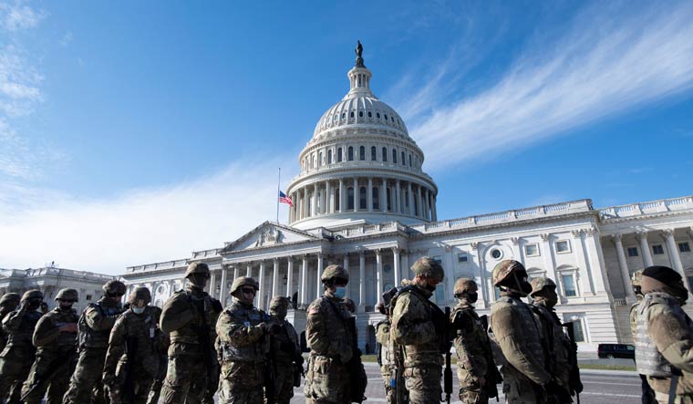 Members of the U.S. National Guard arrive, as the U.S. Capitol goes into lockdown during the dress rehearsal ahead of U.S. President-elect Joe Biden's inauguration in Washington, U.S., January 18, 2021 | Rod Lamkey/Pool via REUTERS
